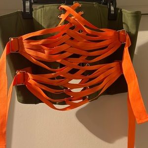 Akira camo green corset with orange straps. Brand new with tags. Size X-Large